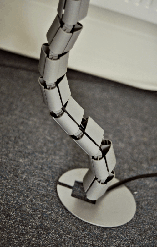 Кабелна спирала от под към бюро, 0.8м дължина, с метална основа и фиксатор към бюро, цвят Сив ABL